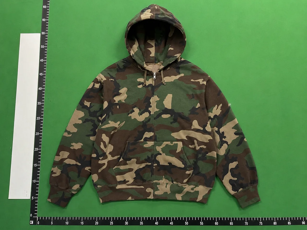 QC photo reference for Supreme Hooded Zip-Up Thermal Camo Jacket