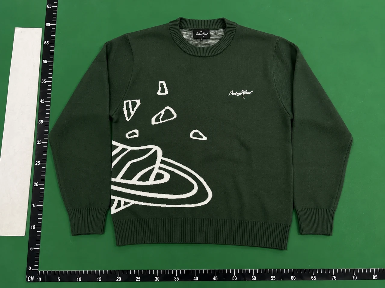 QC photo 1 for Broken Planet Graphic Sweater — Dark Green